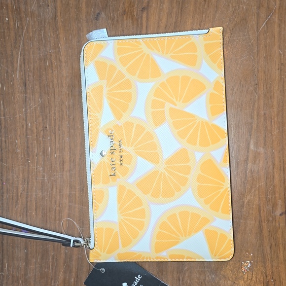 kate spade Handbags - Kate Spade Orange Print Medium L Zip Wristlet NWT